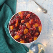 overhead photo of orange cranberry sauce on a table