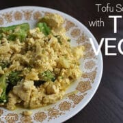 vintage plate on a wooden table with a vegan broccoli and tofu scramble
