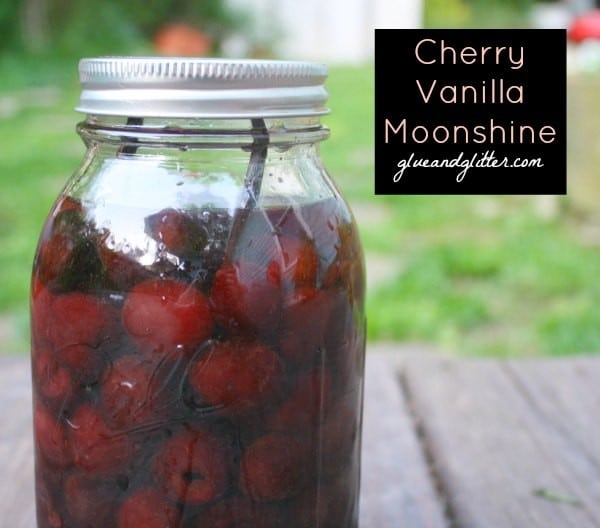 jar of cherry vanilla moonshine on a picnic table