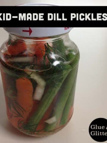 A close up of a bottle of carrot, green bean, and onion dill pickles with text overlay