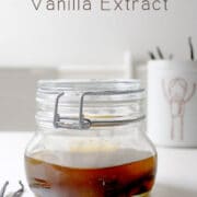 jar of vanilla glycerite, fully steeped, next to a jar of vanilla beans with text overlay