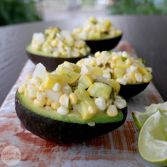 tray of avocados stuffed with corn and summer squash