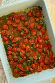 oven roasted cherry tomatoes in the baking pan, after baking