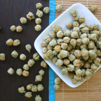 wasabi chickpeas on a serving dish on a wooden table