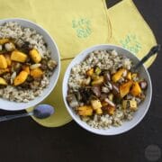 bowls of barley topped with roasted vegetables