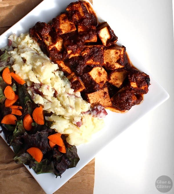 plate of bbq tofu with mashed potatoes and a salad