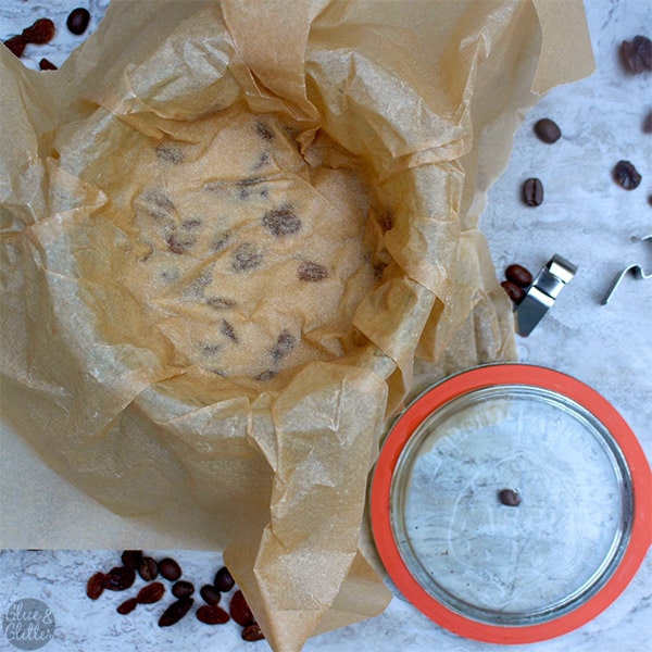 overhead photo showing the pint of ice cream with parchment paper pressed on top to prevent freezer burn