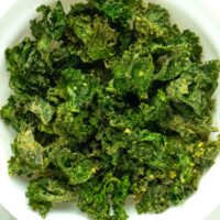 close-up of a bowl of air fryer kale chips with ranch seasoning