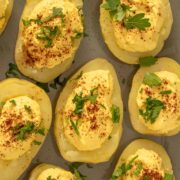 serving tray of deviled potatoes topped with paprika and parsley