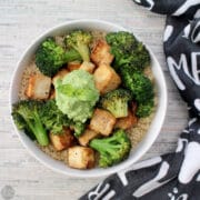 photo of a tofu and broccoli bowl with quinoa and pesto