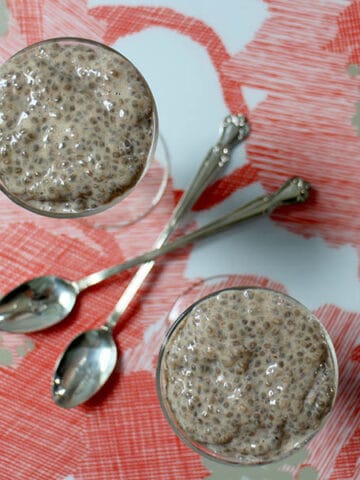 overhead photo of chai chia puddings with spoons