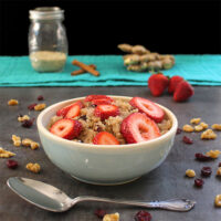 bowl of quinoa porridge with strawberries