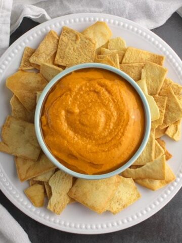overhead photo of curried hummus with pita chips