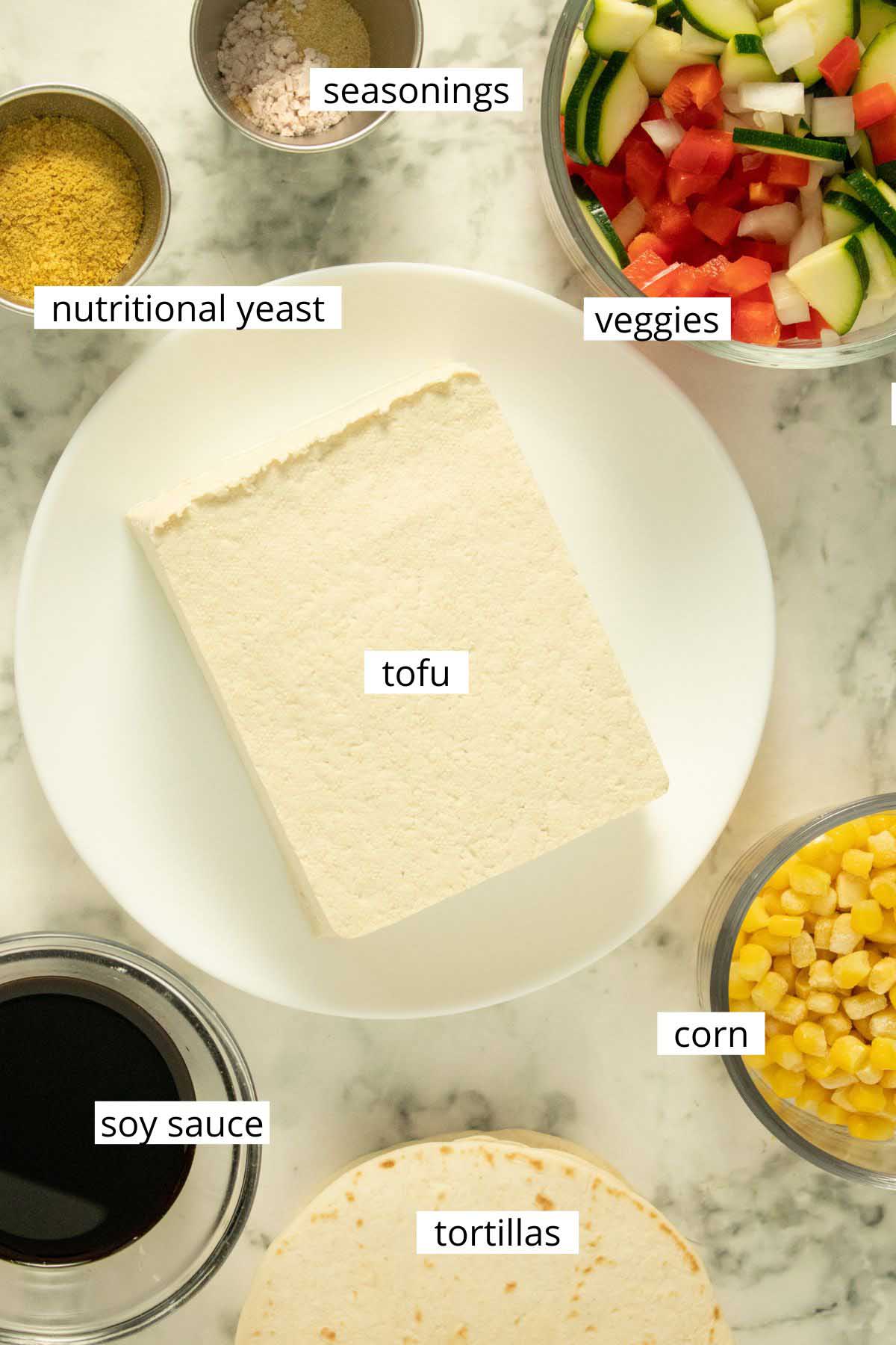 tofu breakfast taco ingredients on a marble table