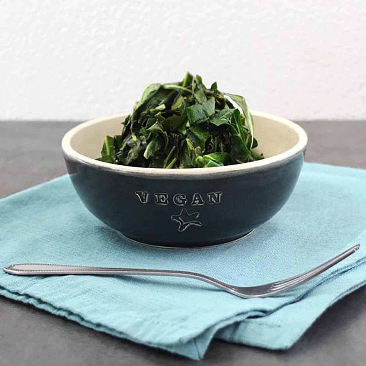 bowl of collard greens on a slate table