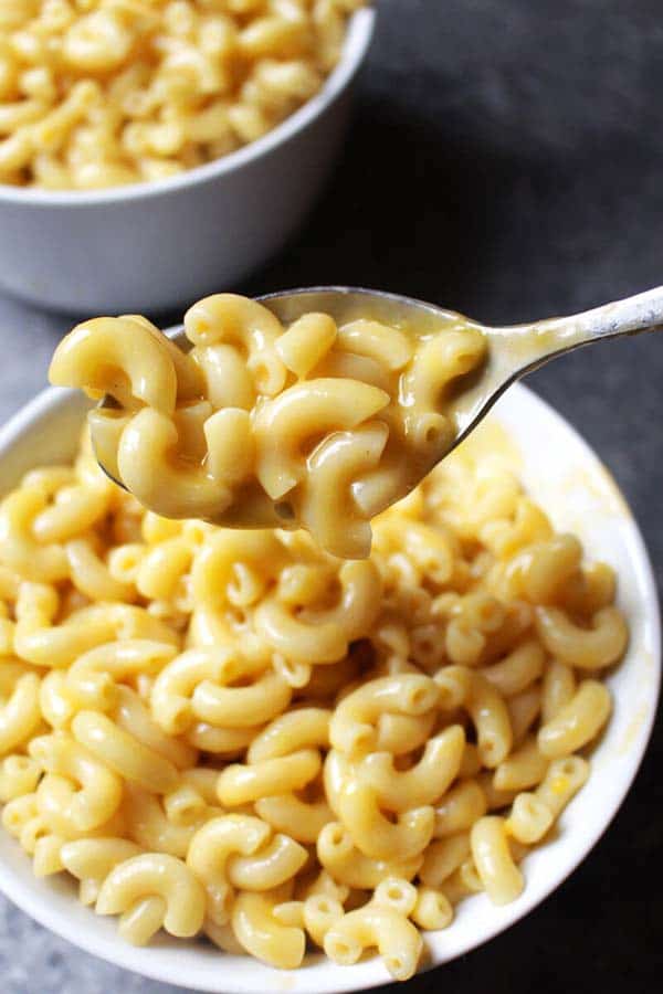 spoon taking a bite of Vegan Instant Pot Mac and Cheese