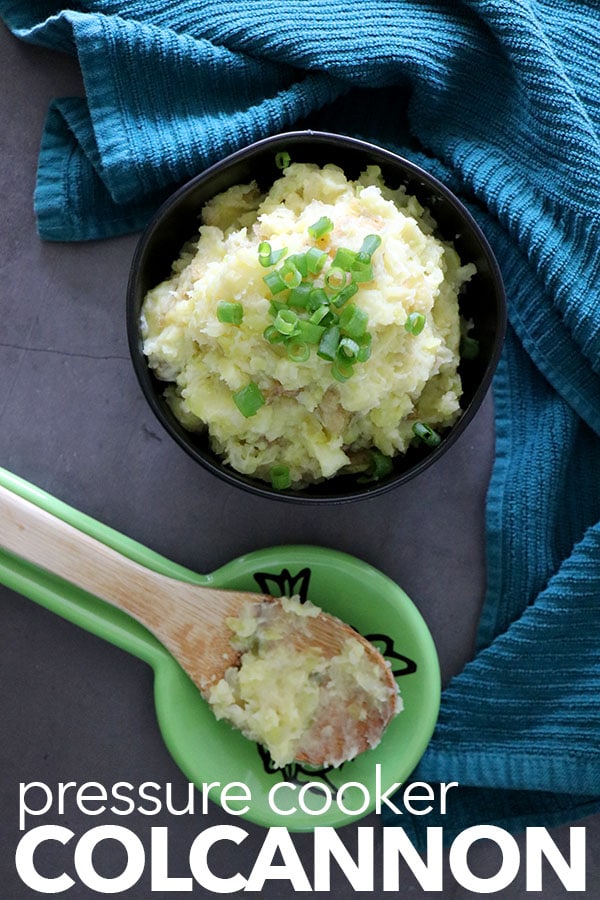 Bowl of vegan colcannon with wooden serving spoon