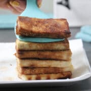 serving crispy tofu from a serving plate