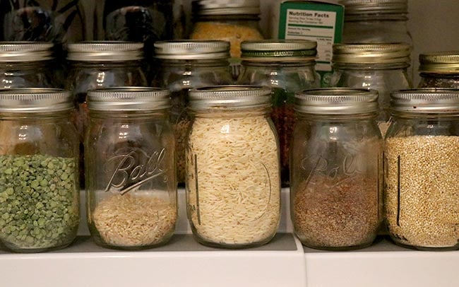 jars of dried grains and beans in a pantry