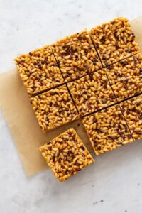 overhead photo of peanut butter rice crispy treats on a white marble tabletop
