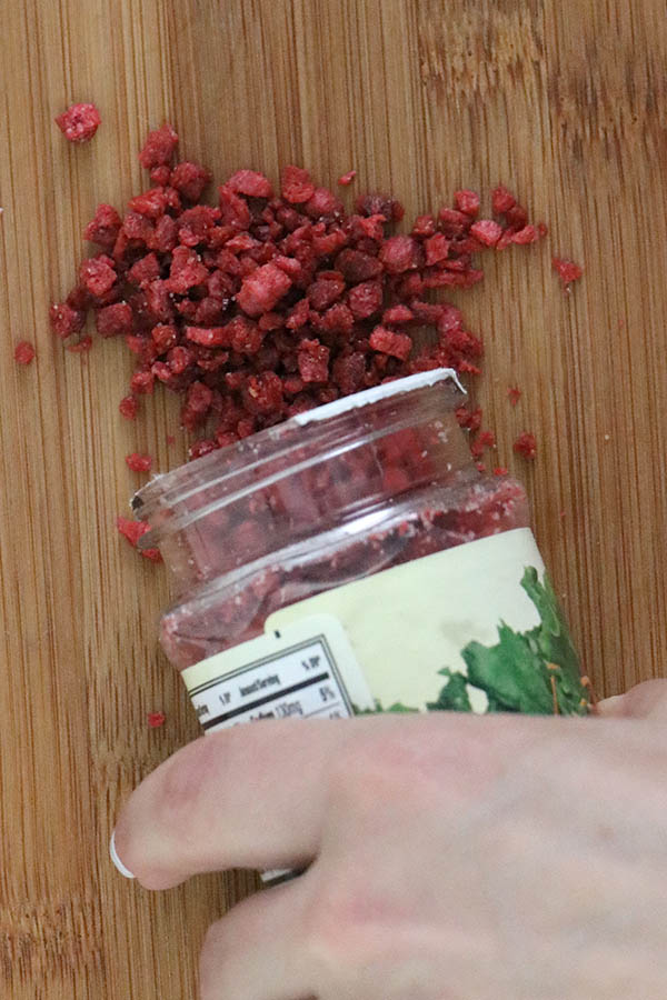 pouring vegan bacon bits out of the bottle