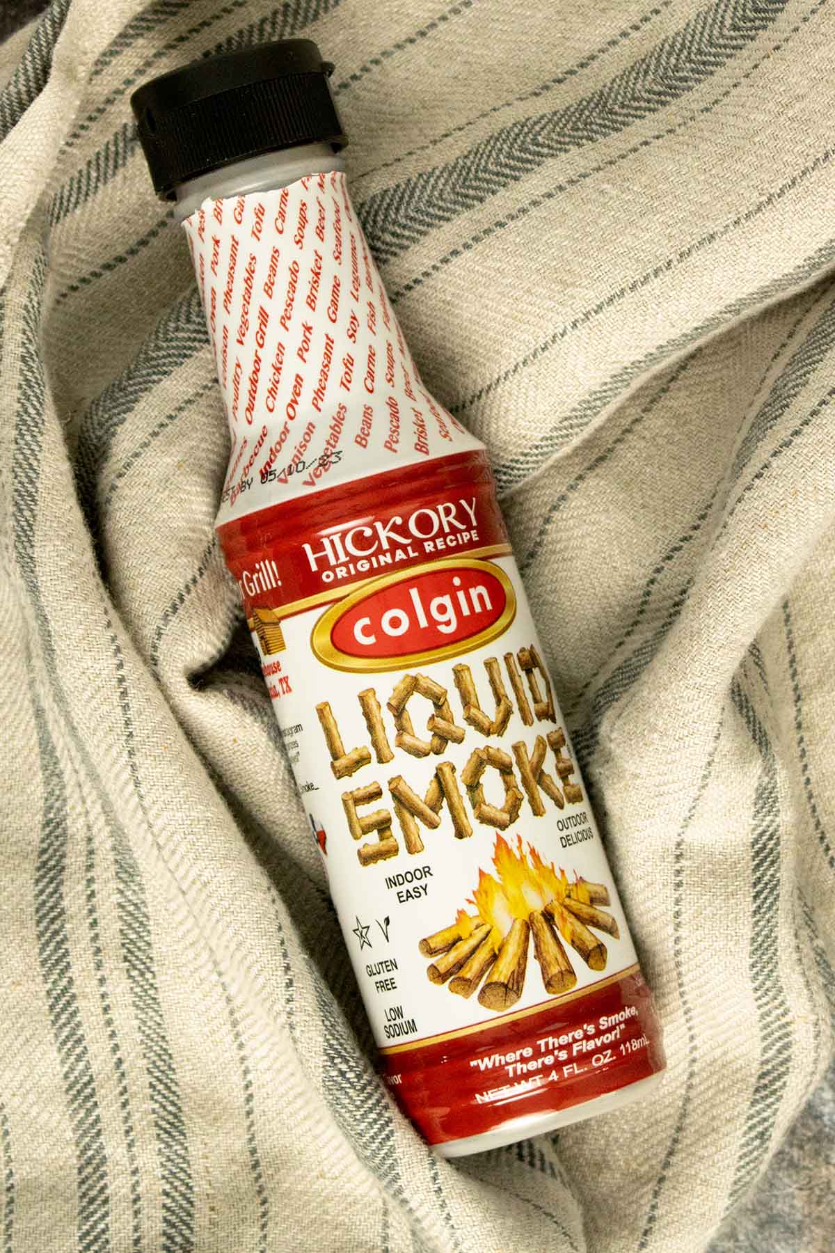 bottle of liquid smoke on a kitchen towel