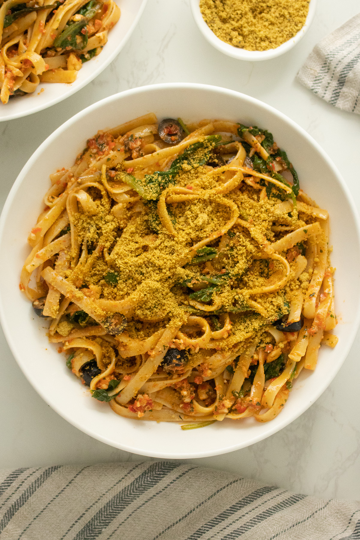 red pepper pesto pasta topped with fairy dust