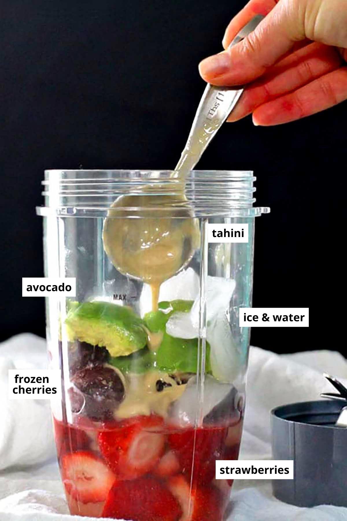 all of the smoothie ingredients in the blender with text labels on each