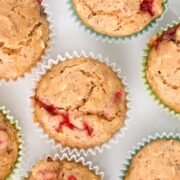 overhead photo of vegan strawberry muffins in the muffin tin