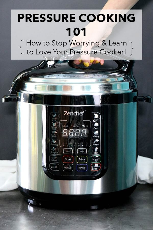 hand opening an electric pressure cooker lid