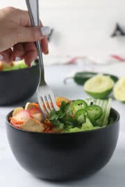 fork taking a bite of tofu banh mi salad