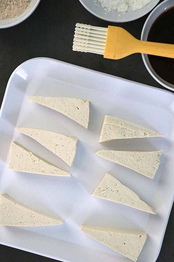 perfect tofu triangles on a white plate
