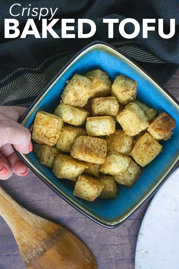overhead photo of baked tofu in a blue bowl