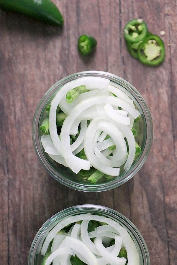 green beans, onions, and jalapenos in a mason jar