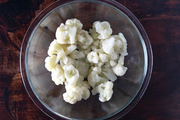 glass bowl of thawed cauliflower florets