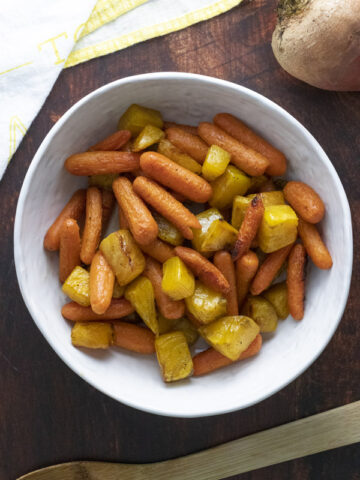 a serving bowl of roasted carrots and golden beets
