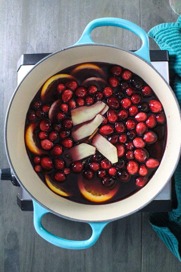 overhead photo of cranberry mulled wine in the pot before simmering
