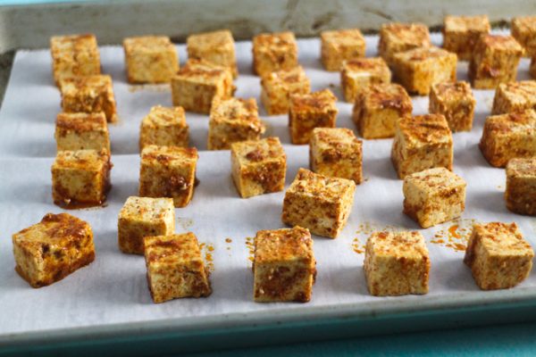 marinated tofu on a baking sheet, about to go into the oven