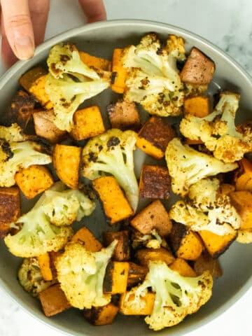 serving dish of roasted cauliflower and sweet potato