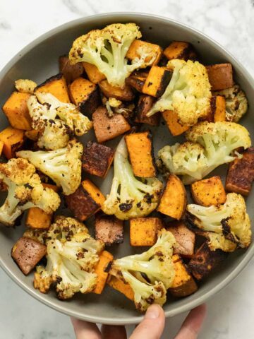 serving dish of roasted cauliflower and sweet potato
