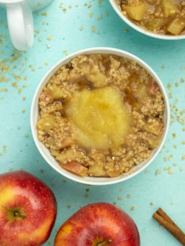 overhead photo of apple steel cut oatmeal with a dollop of applesauce on top