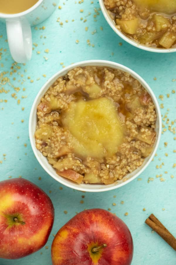 overhead photo of apple steel cut oatmeal with a dollop of applesauce on top
