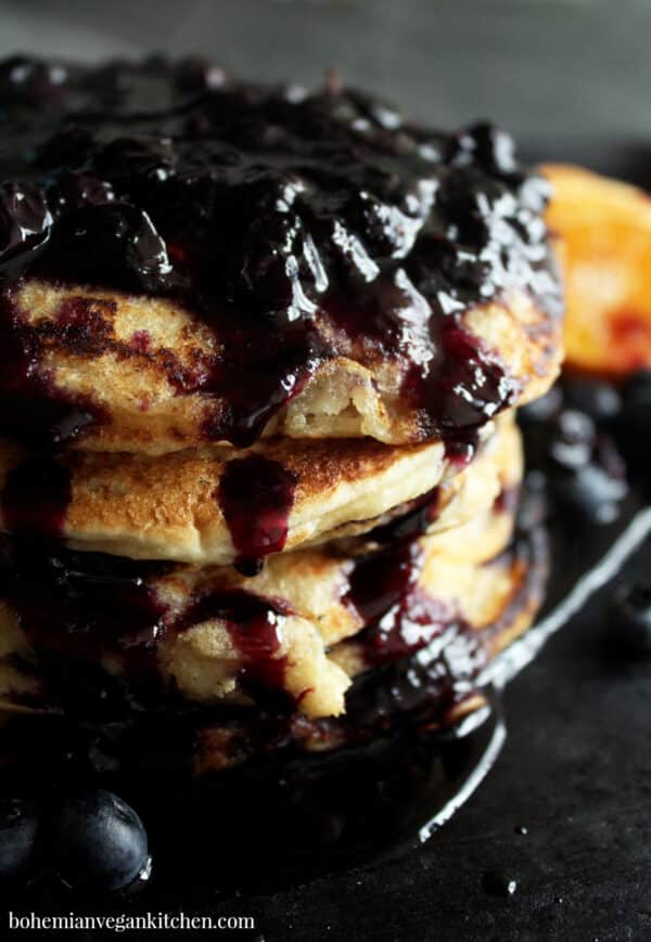 close-up of vegan pancakes with blueberry syrup