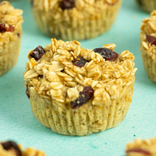 vegan baked oatmeal cups on a blue table