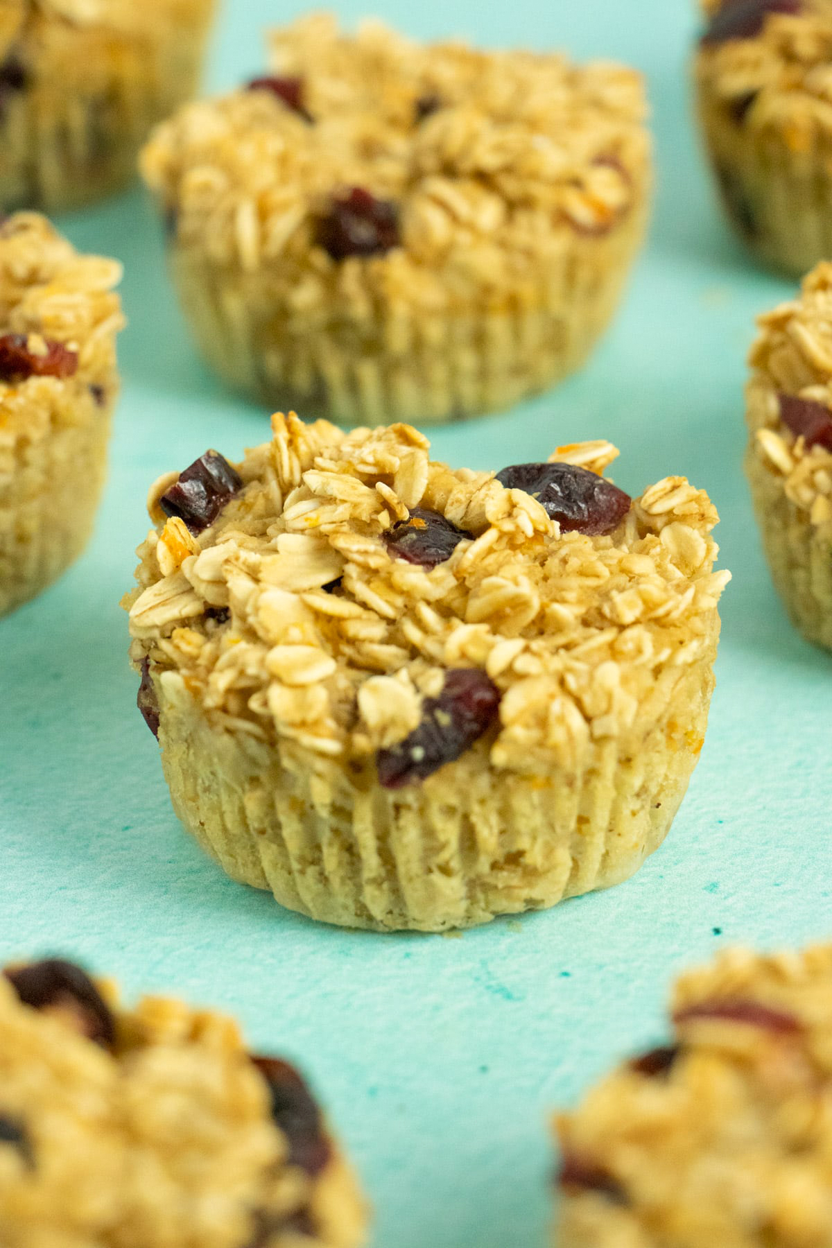 vegan baked oatmeal cups on a blue table