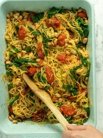 A baking pan filled with pasta and vegetables