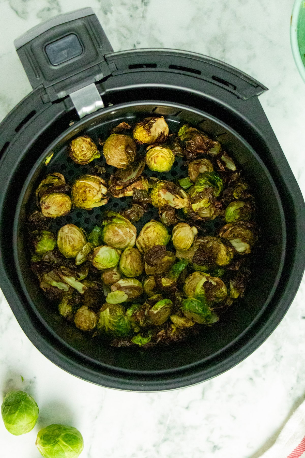 cooked Brussels sprouts in the air fryer basket