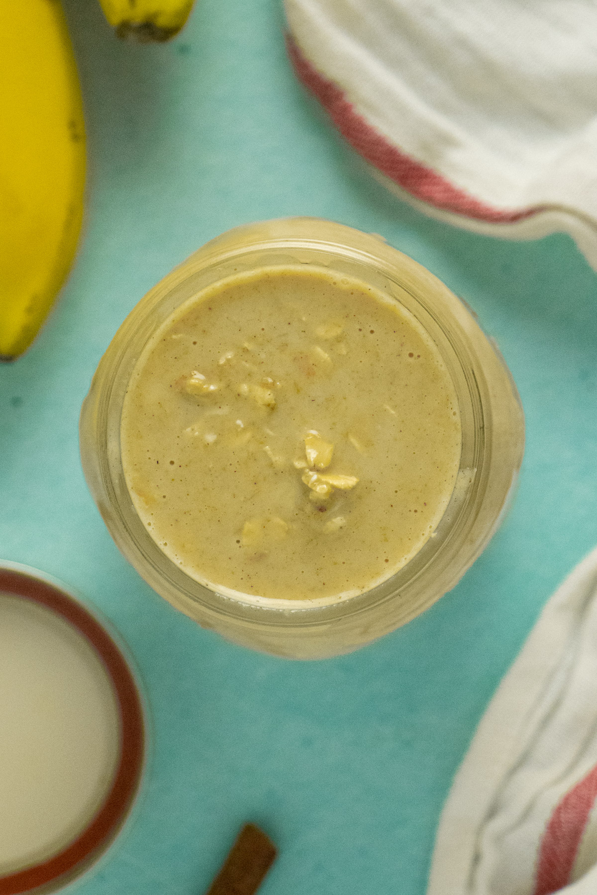overhead photo of peanut butter banana overnight oats in a jar before refrigerating