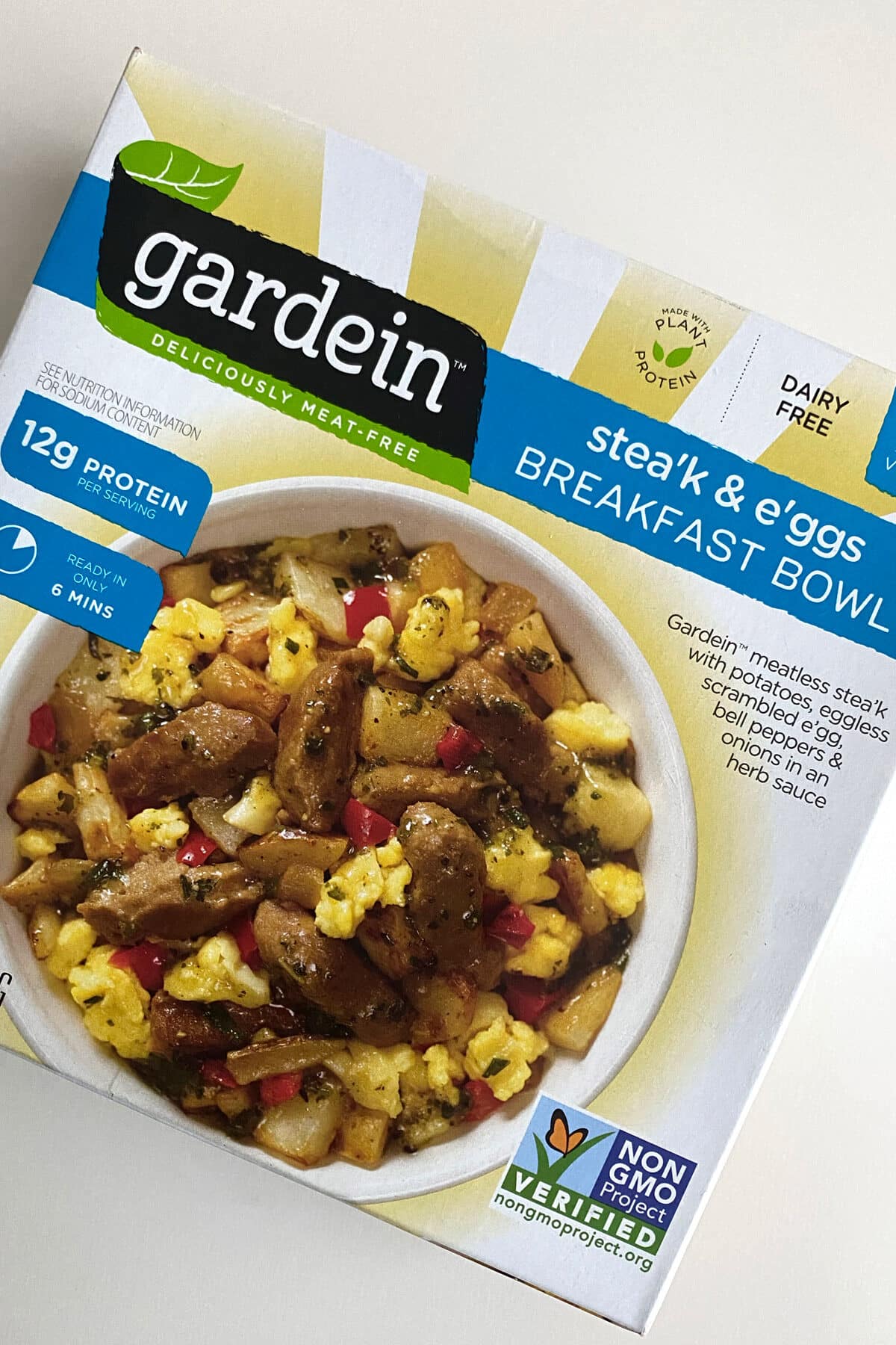 package of Gardein Stea'k & E'ggs Breakfast Bowl on a white table top