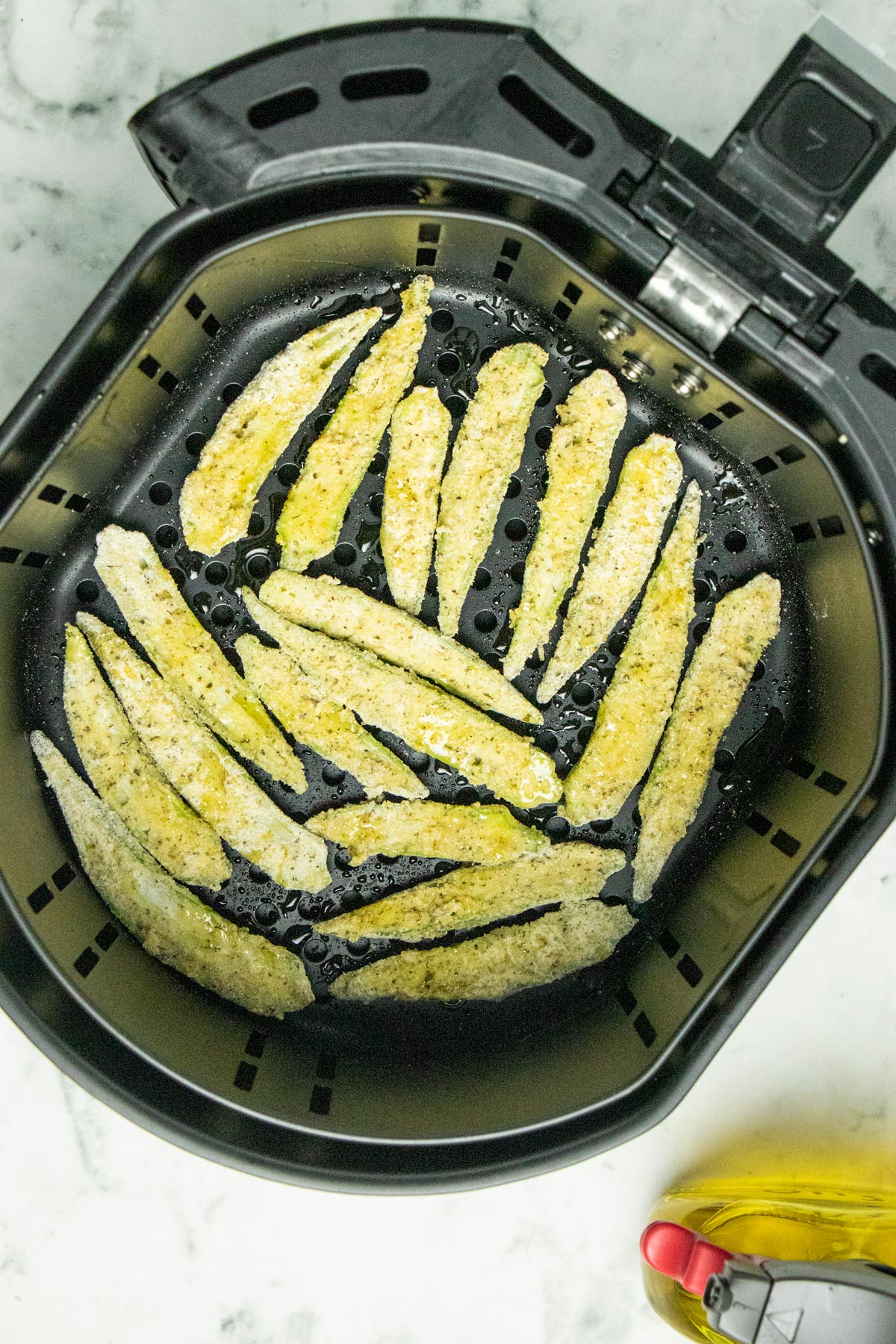 uncooked okra in the air fryer basket